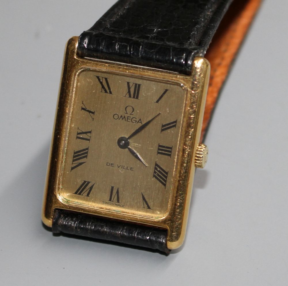 A gentlemans gold plated Omega De Ville quartz dress wrist watch, on associated strap.